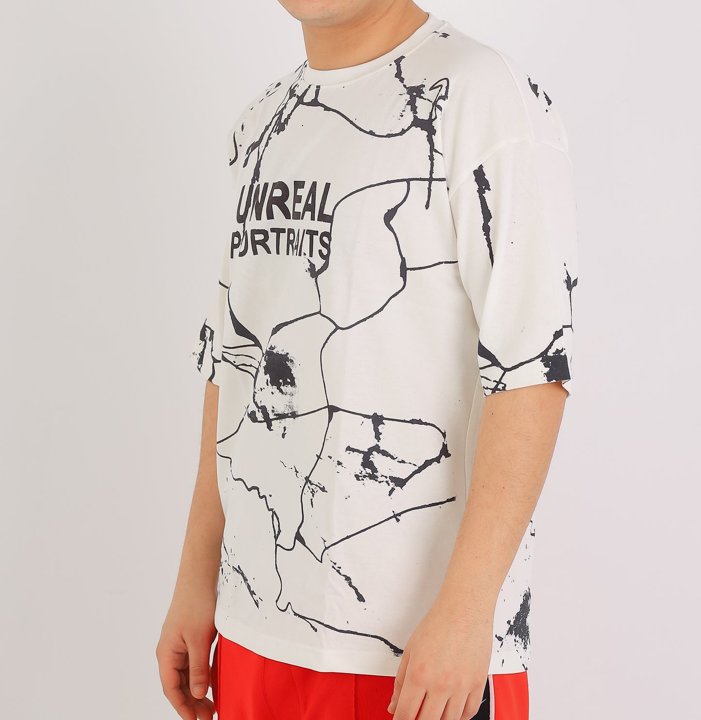 UNREAL PORTRAITS Cracked Pattern Tee – Monochrome Edition
